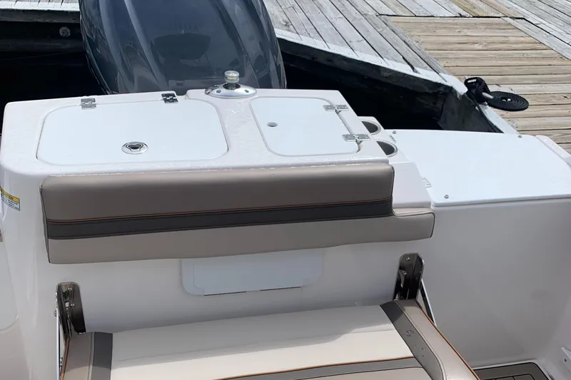 Slide: The Image of 2022 Cutwater C-24 DC boat interior with seating and storage at dock. - 13