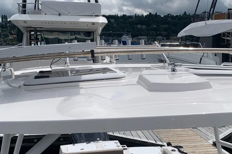 Slide: The Image of 2022 Cutwater C-24 DC boat docked at marina under cloudy skies. - 17