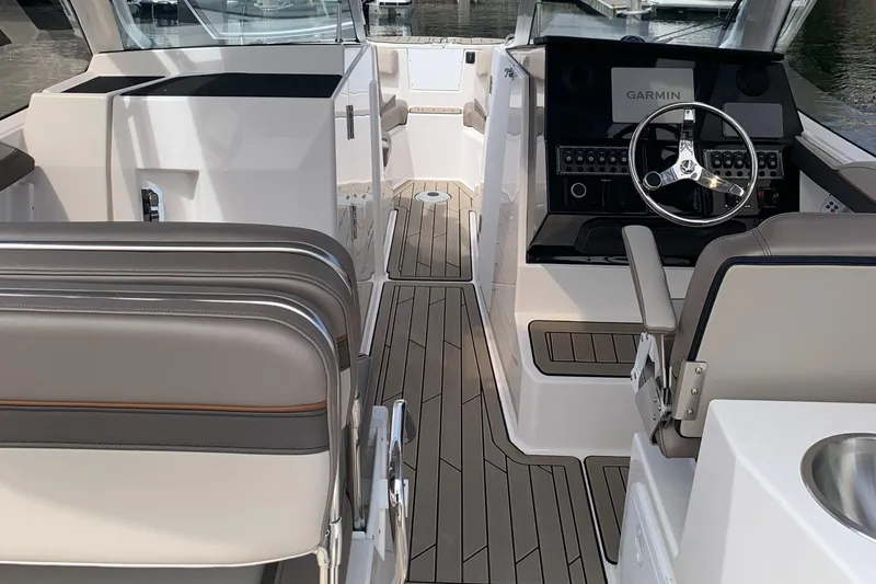 Slide: The Image of Interior of 2022 Cutwater C-24 DC boat with modern helm and seating. - 6