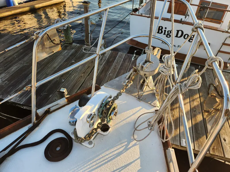 Slide: The Image of 1979 Morgan 45 Ketch sailboat deck with anchor chain and ropes at dock. - 18