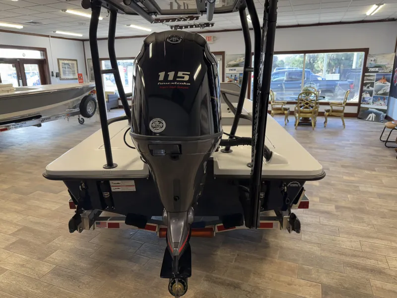 Slide: The Image of 2025 Maverick 18 HPX-V boat with 115 horsepower engine displayed indoors. - 15