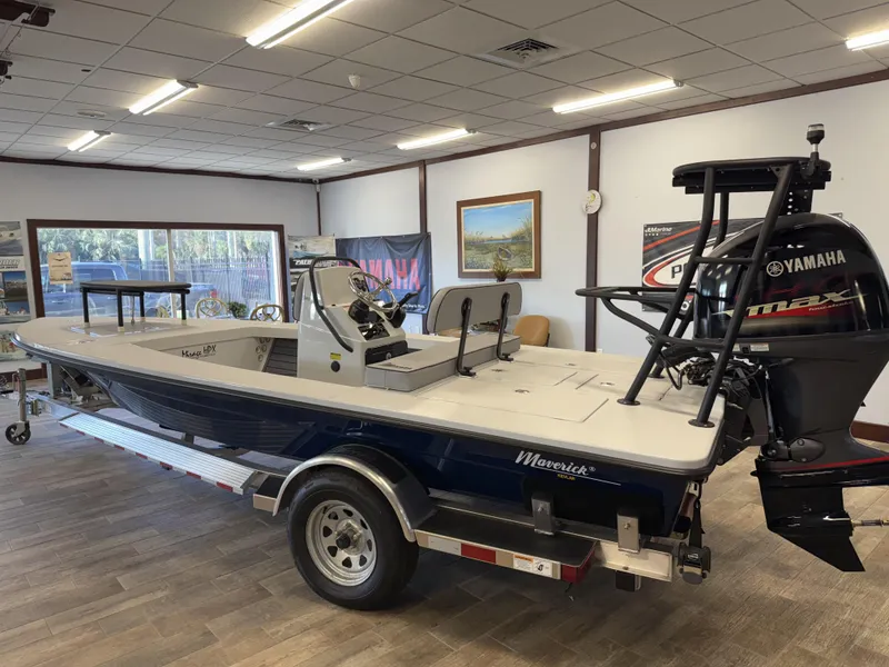 Slide: The Image of 2025 Maverick 18 HPX-V boat with Yamaha engine displayed indoors. - 17