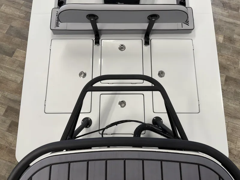 Slide: The Image of 2025 Maverick 18 HPX-V boat deck with storage compartments and seating, viewed from above. - 18