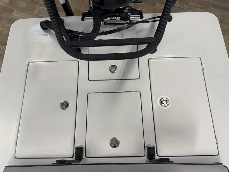 Slide: The Image of 2025 Maverick 18 HPX-V boat deck with storage compartments and steering mechanism. - 22