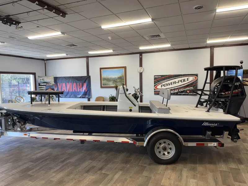 Slide: The Image of 2025 Maverick 18 HPX-V boat displayed indoors on a trailer. - 5