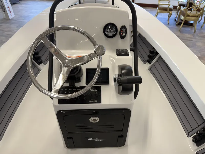 Slide: The Image of 2025 Maverick 18 HPX-V boat console with steering wheel and controls. - 8