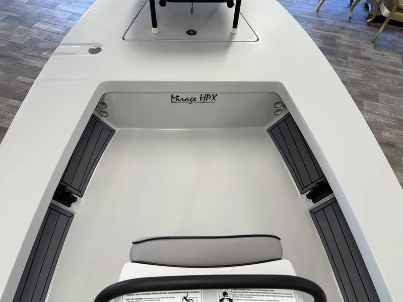 Slide: The Image of 2025 Maverick 18 HPX-V boat interior with gray seating and Mirage HPX branding. - 9