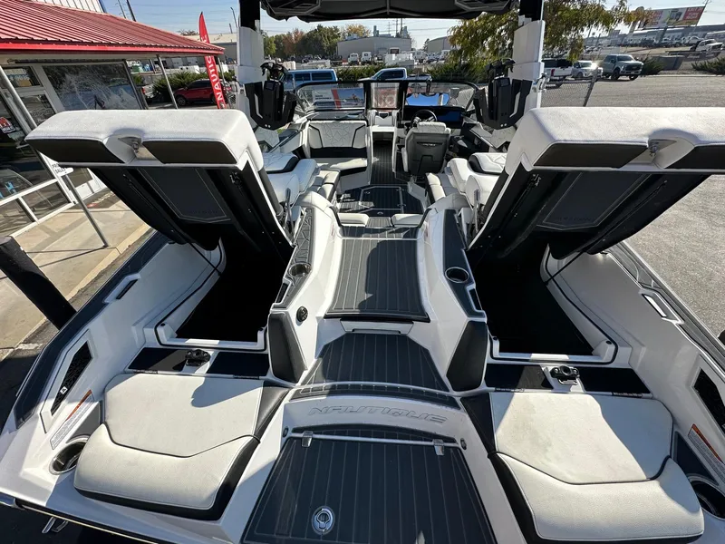 Slide: The Image of 2023 Nautique PARAGON 23 boat interior with luxurious seating and modern design. - 10