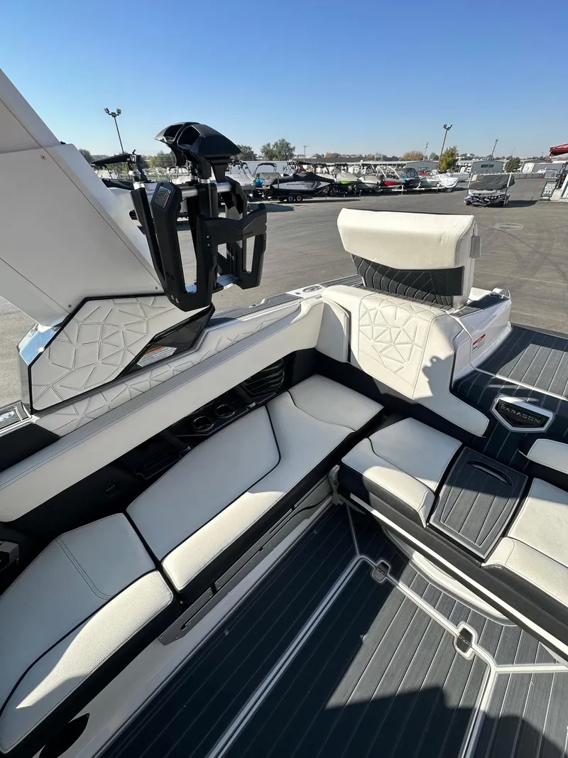 Slide: The Image of 2023 Nautique PARAGON 23 boat interior with luxurious seating and modern design. - 14