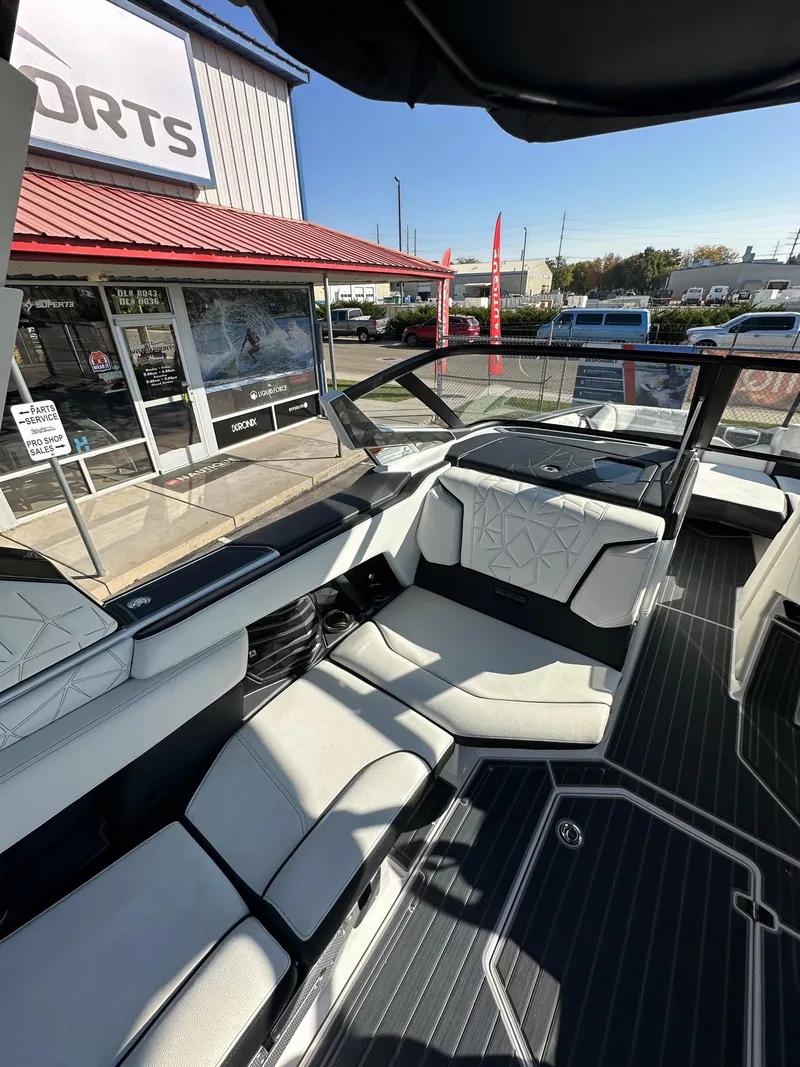 Slide: The Image of 2023 Nautique PARAGON 23 boat interior with luxurious seating and modern design. - 17