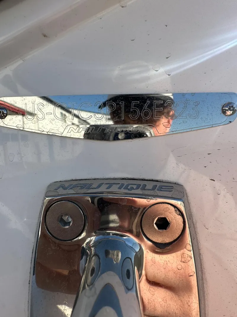 Slide: The Image of 2023 Nautique PARAGON 23 boat identification plate and hardware detail. - 23