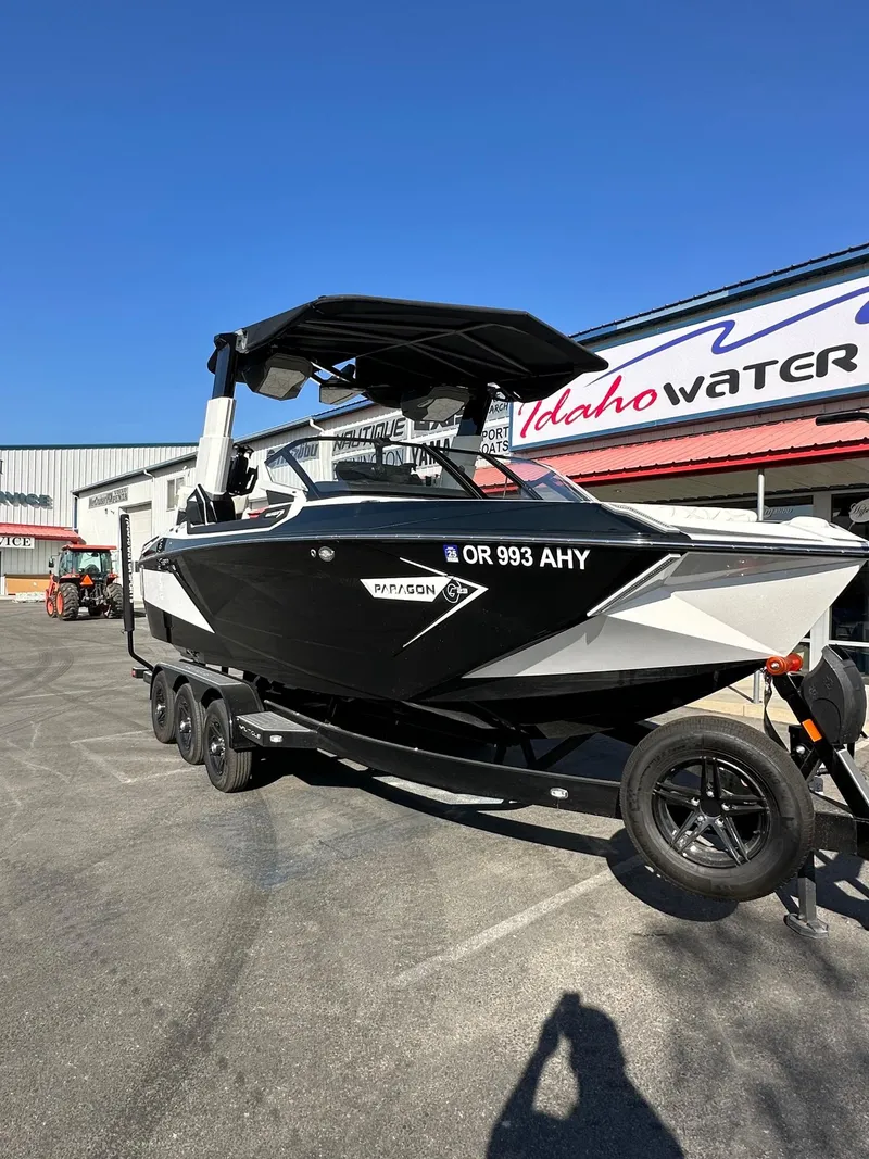 Slide: The Image of 2023 Nautique PARAGON 23 boat on trailer at Idaho Water Sports dealership. - 4