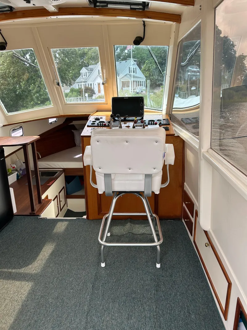 Slide: The Image of Helm of 1996 Mast & Mallet 34 Rabbit Custom boat with scenic window view. - 14