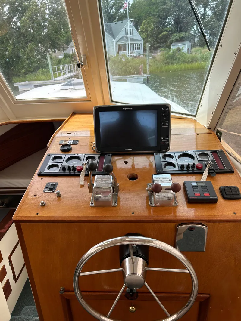 Slide: The Image of 1996 Mast & Mallet 34 Rabbit Custom boat helm with navigation equipment and steering wheel. - 20