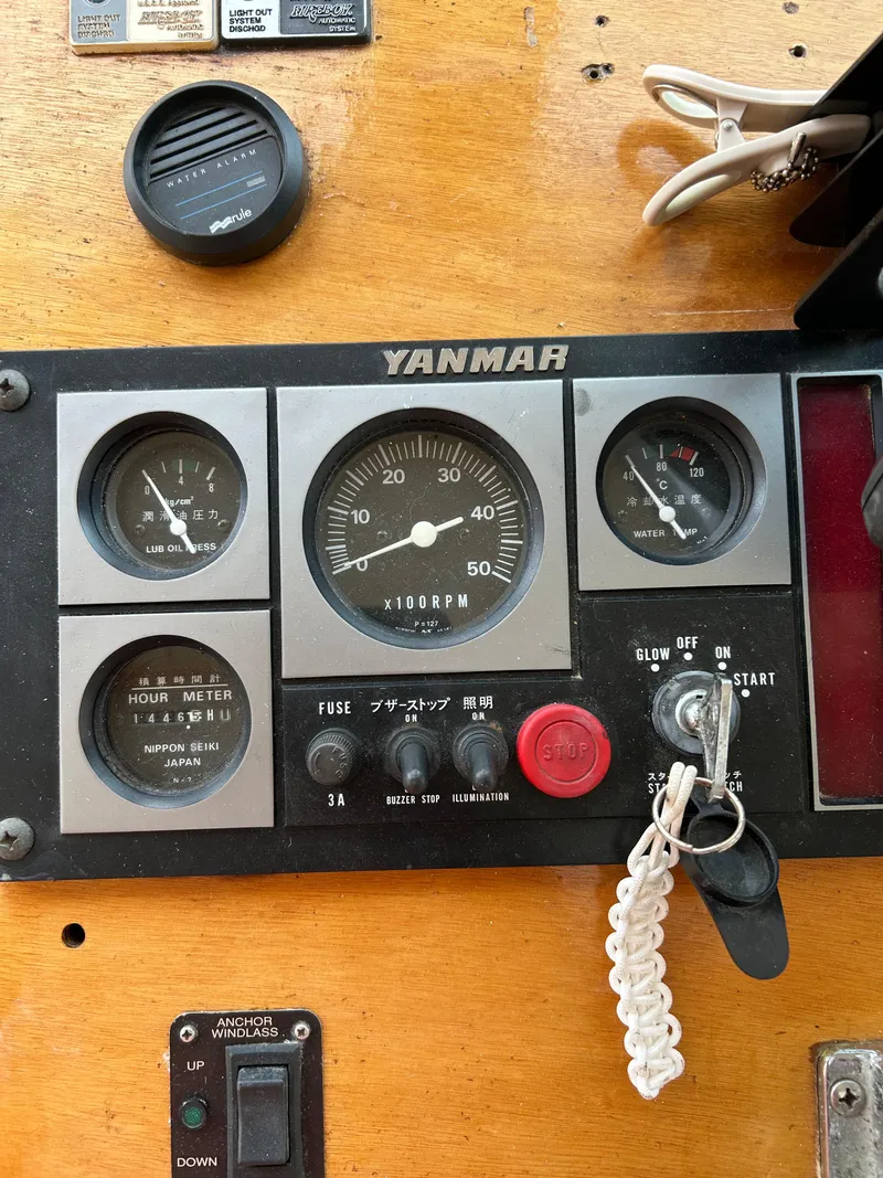 Slide: The Image of Control panel of a 1996 Mast & Mallet 34 Rabbit Custom boat with Yanmar engine gauges. - 23