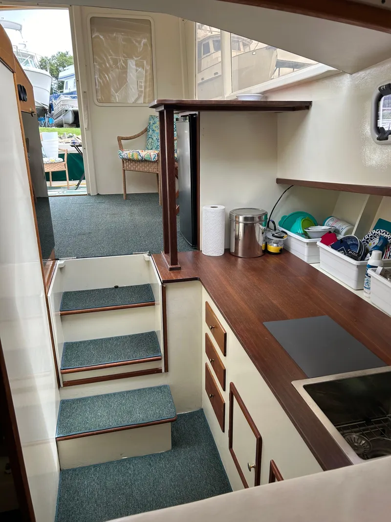 Slide: The Image of Interior of 1996 Mast & Mallet 34 Rabbit Custom boat with modern kitchen area. - 25