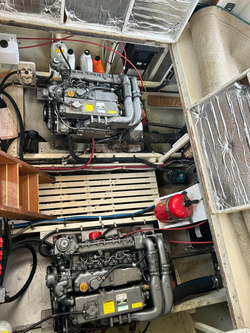 Slide: The Image of Engine room of 1996 Mast & Mallet 34 Rabbit Custom boat, featuring dual engines and equipment. - 33