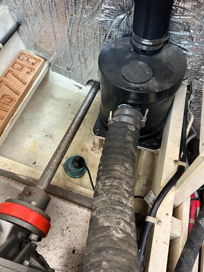 Slide: The Image of Engine compartment of a 1996 Mast & Mallet 34 Rabbit Custom boat, showing mechanical components. - 39