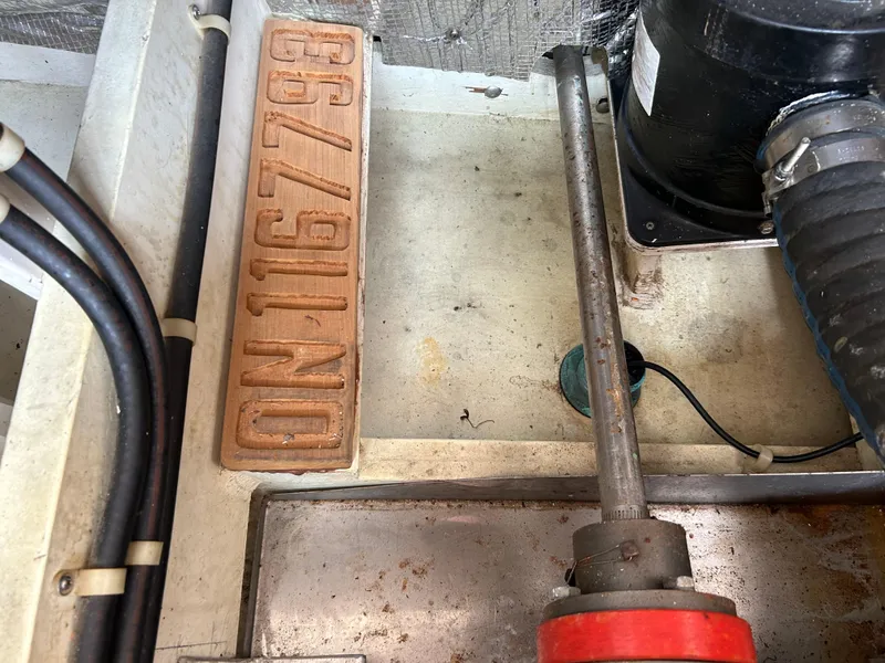 Slide: The Image of Engine compartment of 1996 Mast & Mallet 34 Rabbit Custom boat, showing mechanical components. - 40