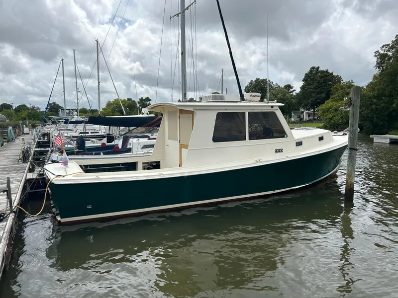 Slide: The Image of 1996 Mast & Mallet 34 Rabbit Custom boat docked in a marina. - 6