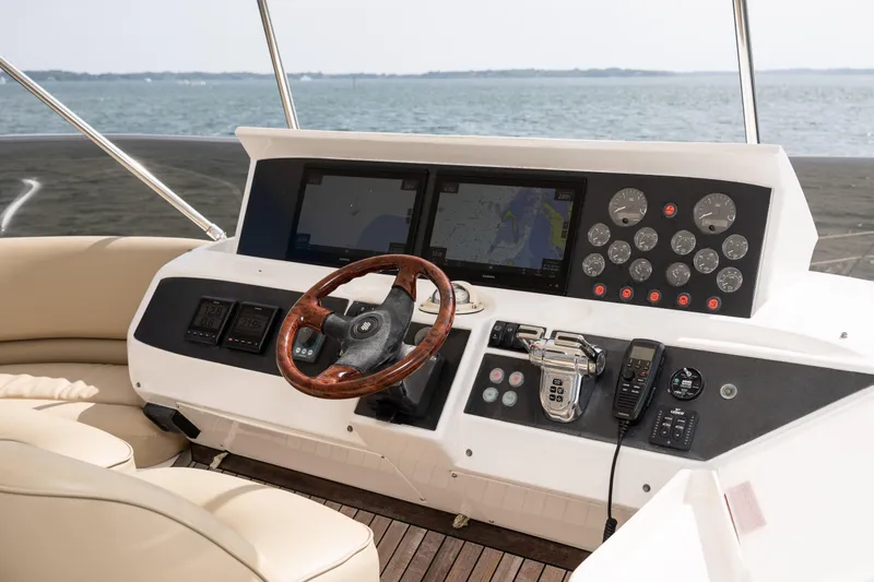 Slide: The Image of Helm of 2008 Viking Princess 75 yacht with navigation screens and controls. - 14