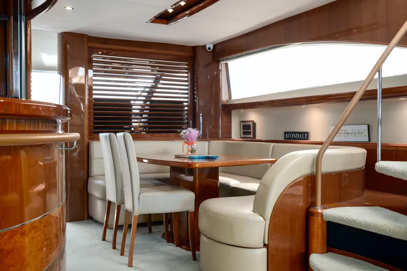 Slide: The Image of Luxurious interior of 2008 Viking Princess 75 yacht with elegant dining area and wooden finishes. - 9