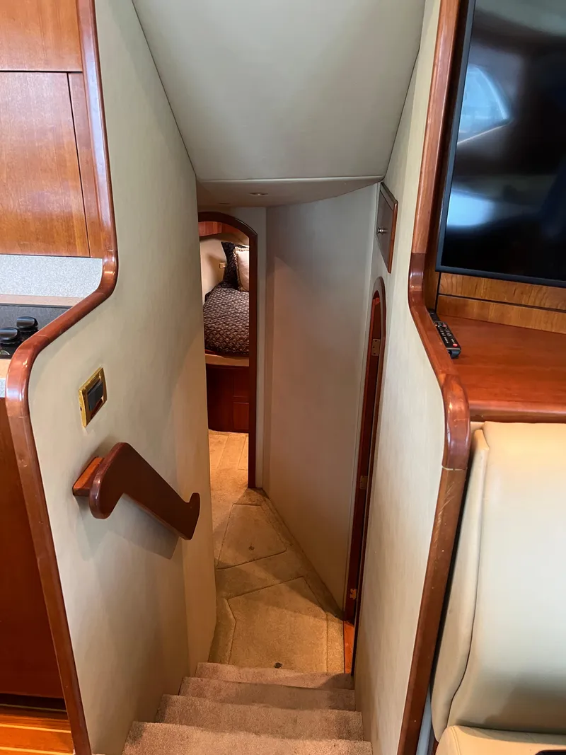 Slide: The Image of Interior stairs of 2005 Rampage 45 Convertible yacht, leading to lower cabin. - 27