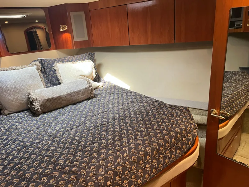 Slide: The Image of Luxurious bedroom interior of 2005 Rampage 45 Convertible yacht with elegant bedding. - 29