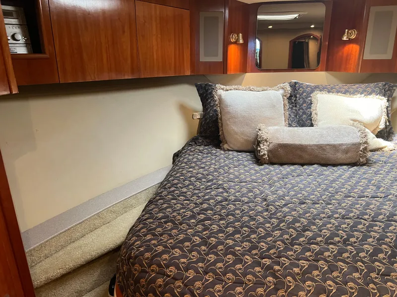 Slide: The Image of Luxurious bedroom interior of 2005 Rampage 45 Convertible yacht with elegant bedding. - 30