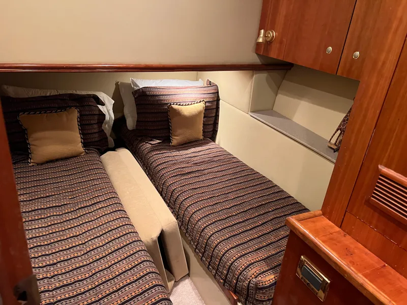 Slide: The Image of Cozy twin cabin in 2005 Rampage 45 Convertible yacht with wood accents. - 31