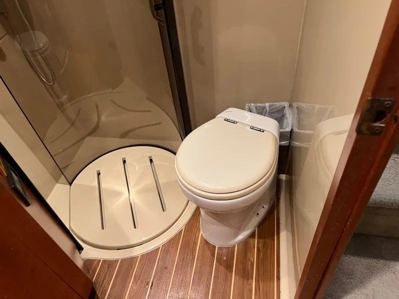 Slide: The Image of Bathroom in 2005 Rampage 45 Convertible yacht with shower and toilet. - 36