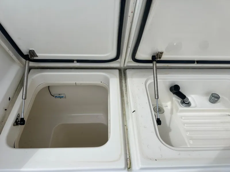 Slide: The Image of Open storage compartments on a 2005 Rampage 45 Convertible boat. - 41