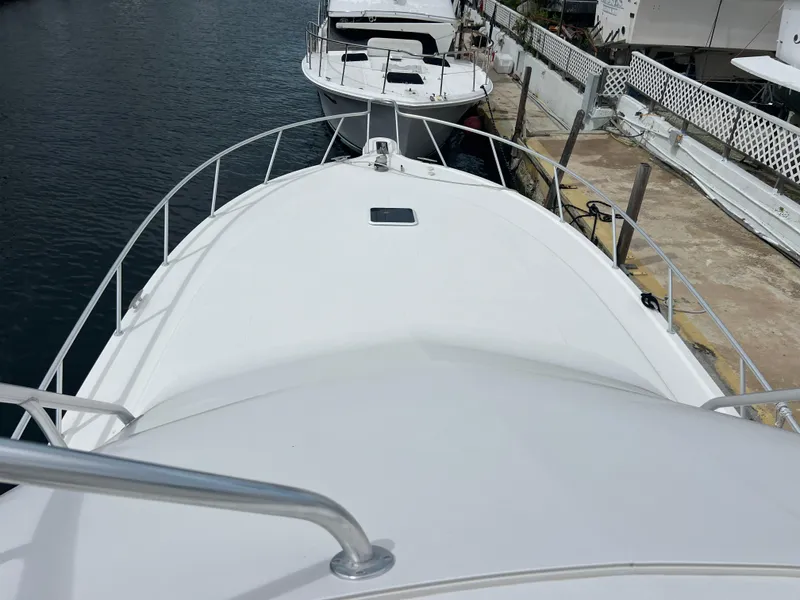 Slide: The Image of 2005 Rampage 45 Convertible yacht docked at marina. - 43