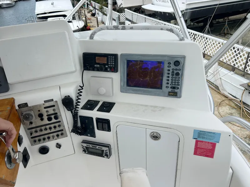 Slide: The Image of 2005 Rampage 45 Convertible boat helm with navigation equipment and controls. - 44