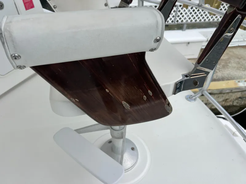 Slide: The Image of Close-up of a 2005 Rampage 45 Convertible boat's helm seat with visible wear. - 49
