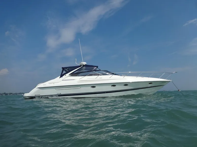 The Image of 1997 Sunseeker Camargue 47 yacht on open water under clear blue sky. - 0