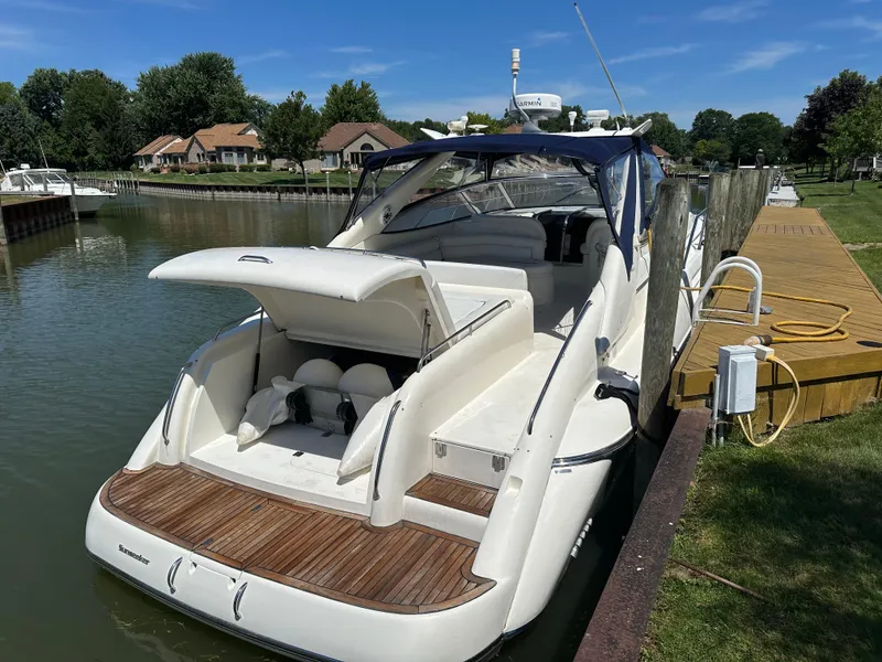 Slide: The Image of 1997 Sunseeker Camargue 47 yacht docked by a wooden pier on a sunny day. - 13