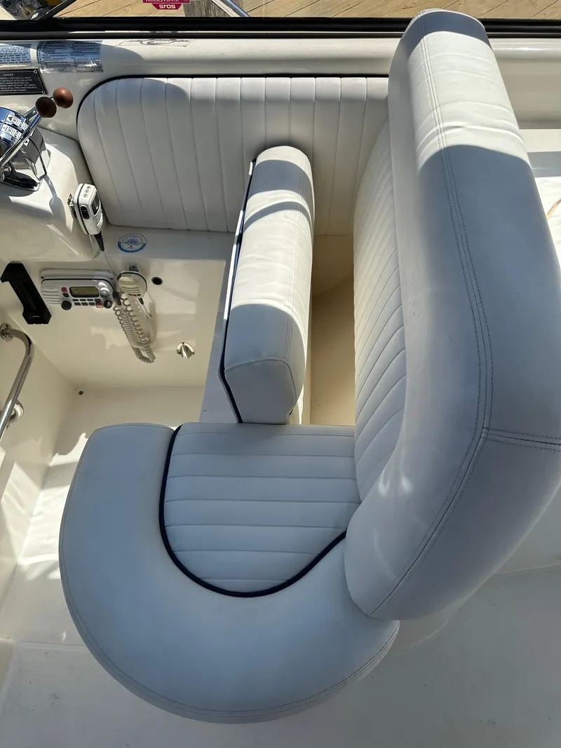 Slide: The Image of Luxurious white seating on 1997 Sunseeker Camargue 47 yacht, showcasing elegant design. - 18