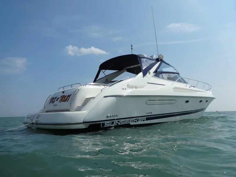 Slide: The Image of 1997 Sunseeker Camargue 47 yacht on open water under clear sky. - 2