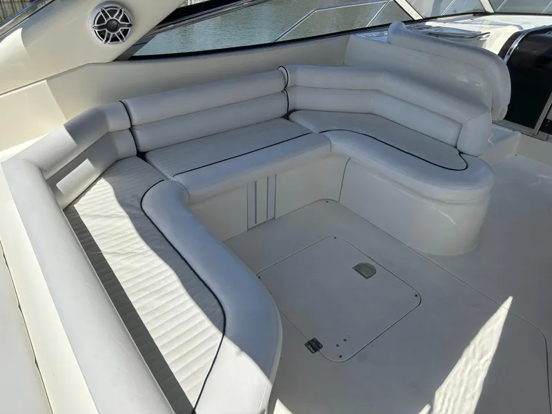 Slide: The Image of Luxurious white seating area on a 1997 Sunseeker Camargue 47 yacht. - 28