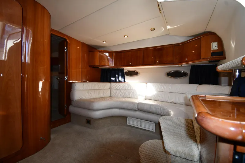 Slide: The Image of Luxurious interior of 1997 Sunseeker Camargue 47 yacht with elegant wood finishes and plush seating. - 35
