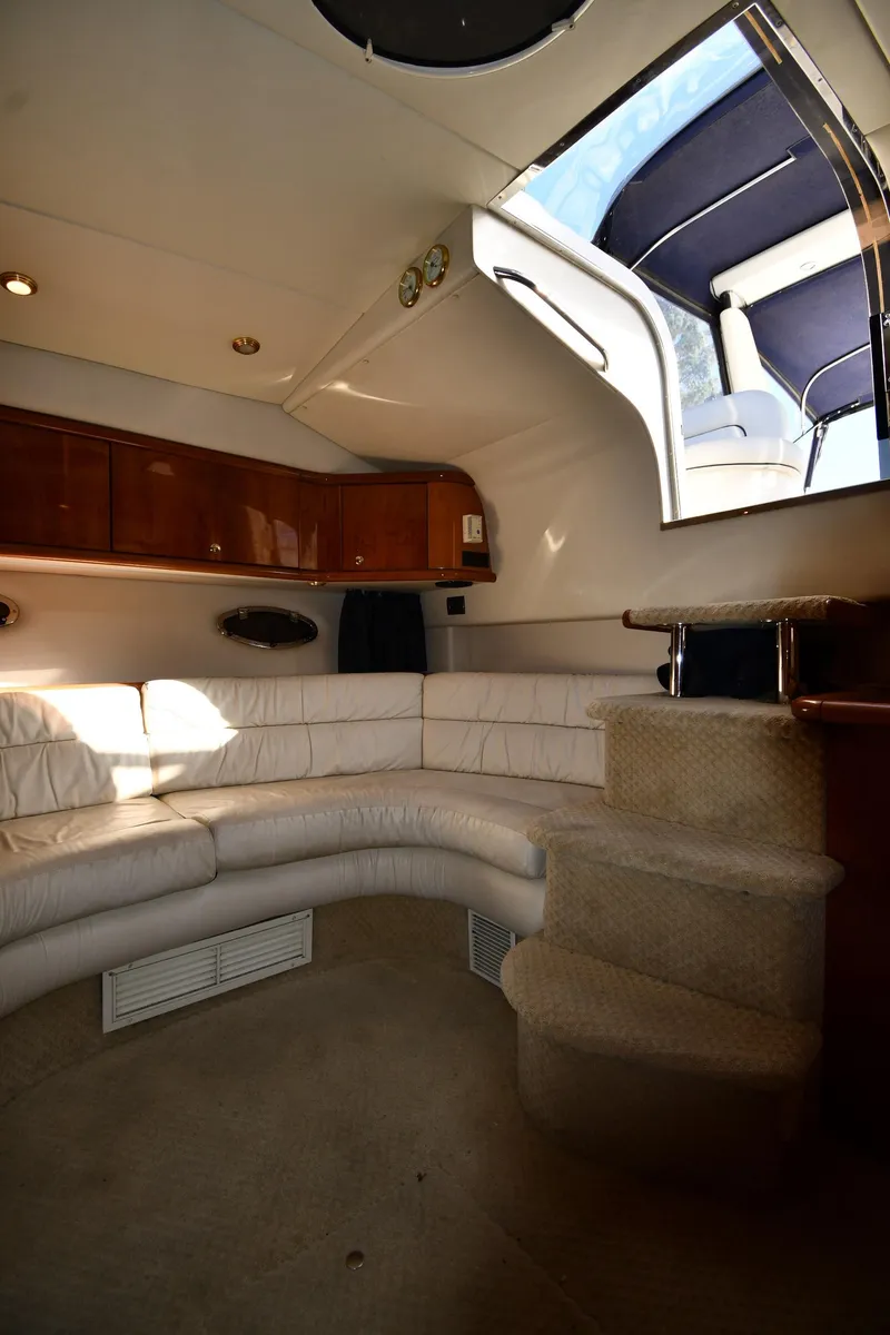 Slide: The Image of Interior of 1997 Sunseeker Camargue 47 yacht with white seating and skylight. - 42