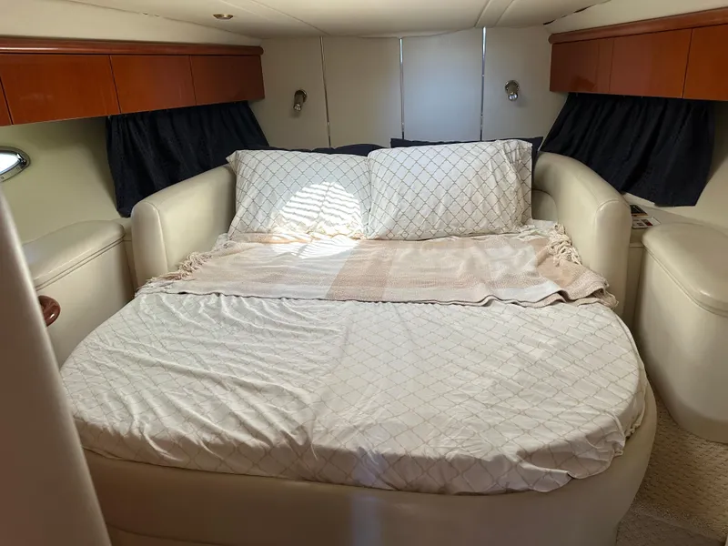 Slide: The Image of Luxurious bedroom interior of 1997 Sunseeker Camargue 47 yacht with cozy bedding. - 44