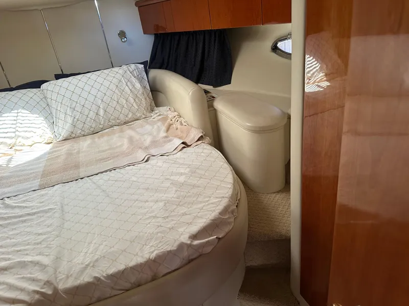 Slide: The Image of Interior cabin of 1997 Sunseeker Camargue 47 yacht with bed and wooden cabinetry. - 45