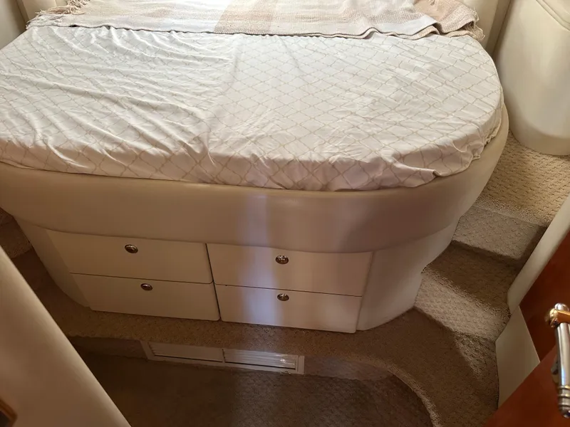 Slide: The Image of Interior cabin of 1997 Sunseeker Camargue 47 with bed and storage drawers. - 46