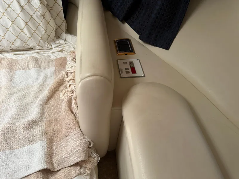 Slide: The Image of Interior of 1997 Sunseeker Camargue 47 yacht with beige seating and control panel. - 47