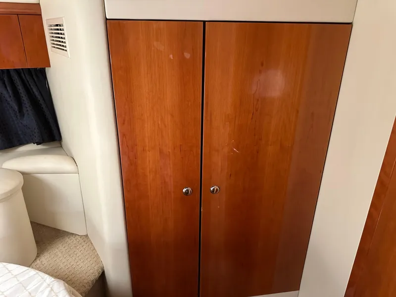 Slide: The Image of Interior of 1997 Sunseeker Camargue 47 with wooden cabinet and seating area. - 48