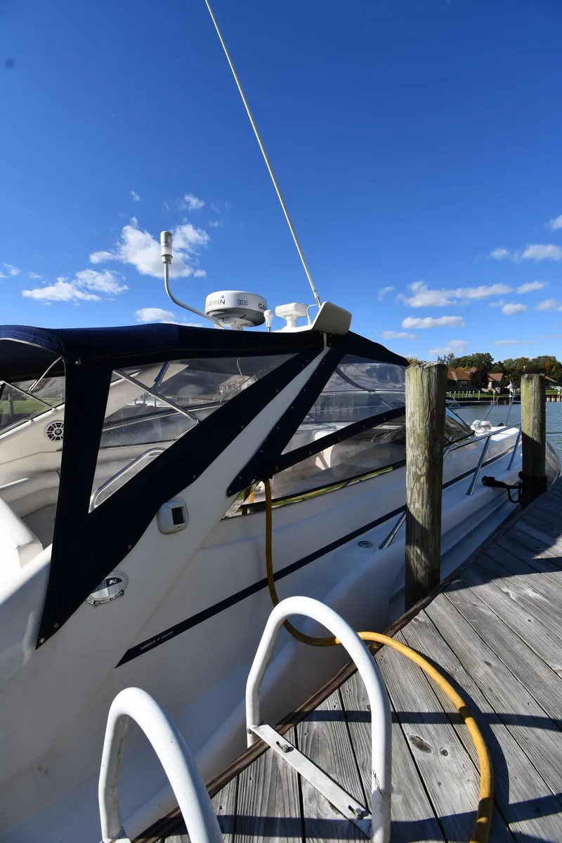 Slide: The Image of 1997 Sunseeker Camargue 47 yacht docked under clear blue sky. - 5
