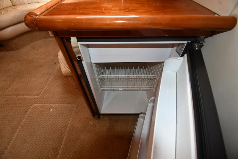 Slide: The Image of Open mini fridge inside 1997 Sunseeker Camargue 47 yacht interior. - 55
