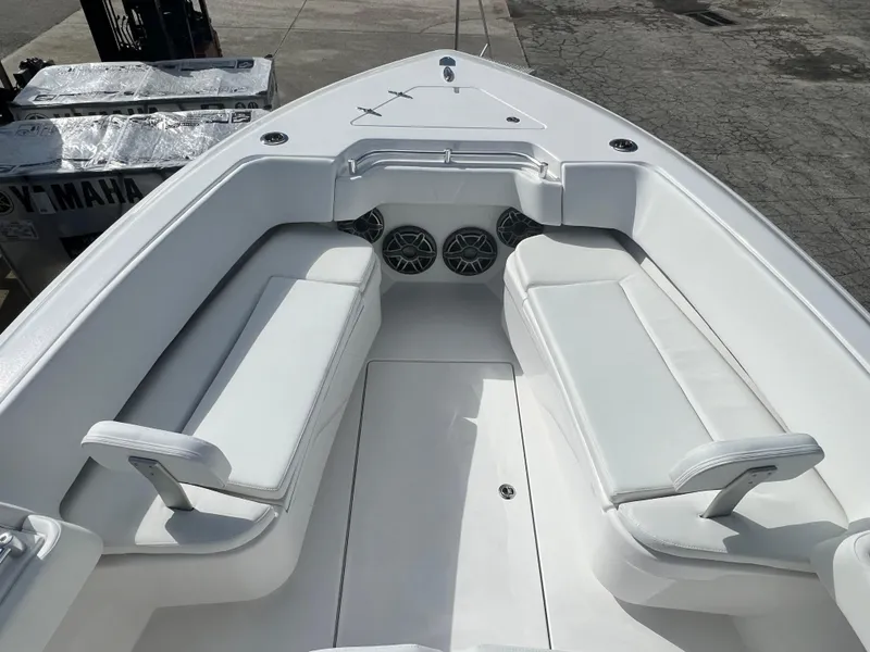 Slide: The Image of 2025 Contender 30 ST boat interior with white seating and speakers. - 13